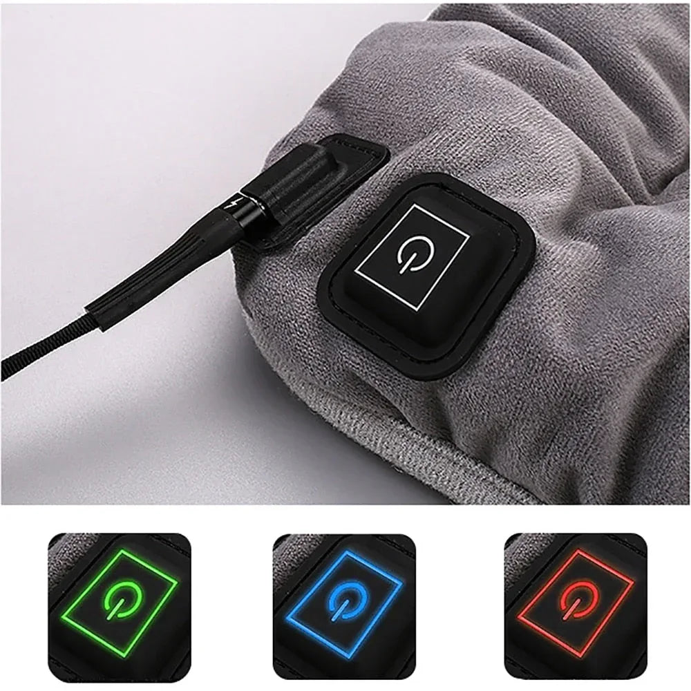 Gray electric heating cushion with black control panel and connected power cable.