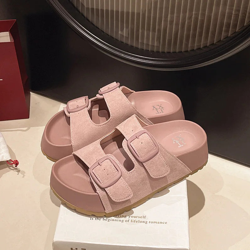 Light pink suede platform slide sandals with two adjustable buckle straps