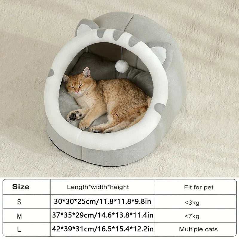 Gray covered cat bed cave tent with cushion interior, white ring opening, pom-pom