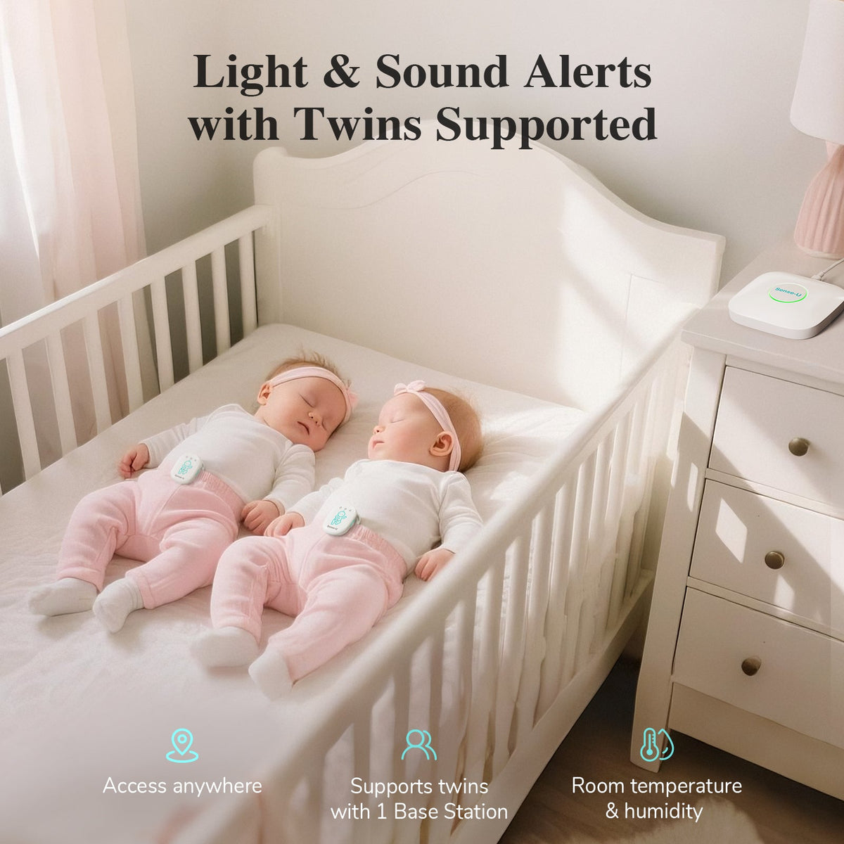 Two baby monitors near crib with white base station for twin supported alerts