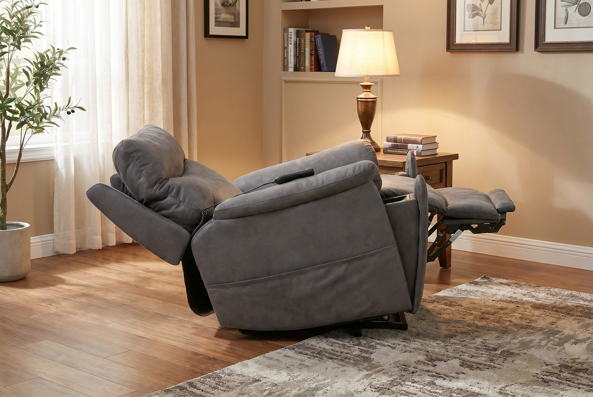 Slate grey recliner chair angled with extended leg support and headrest cushion