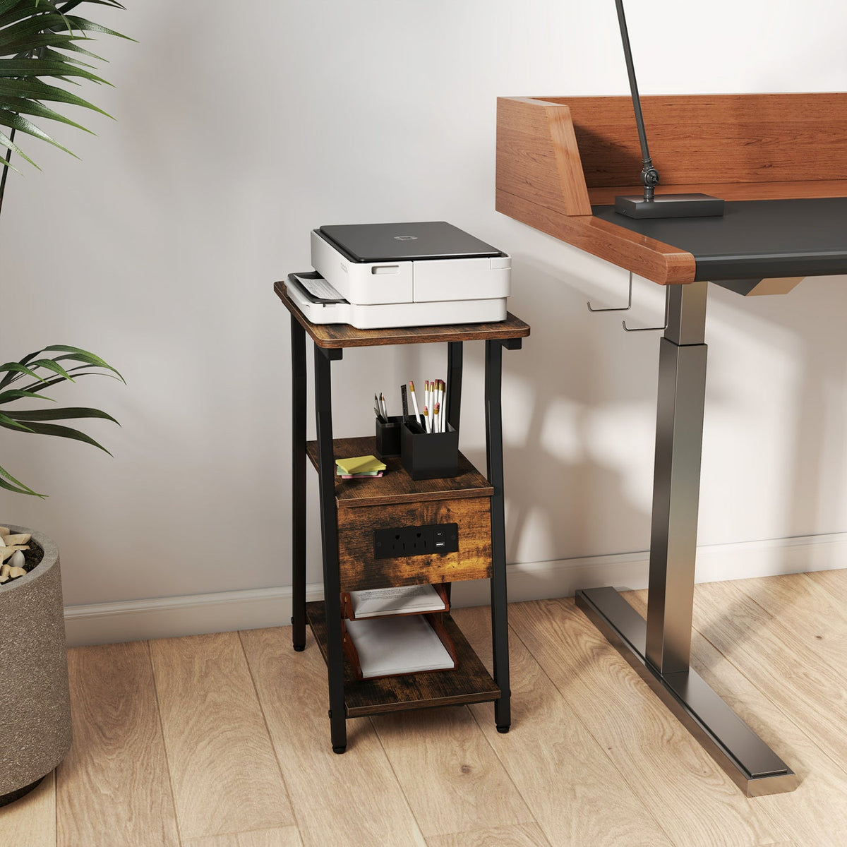 Industrial side table with dark metal legs, 3-tier shelves, and top charging area.