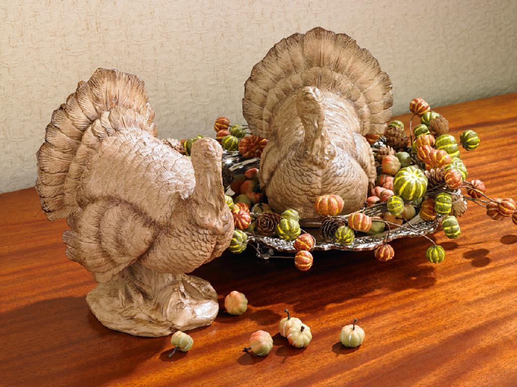 Set of 2 resin turkeys, brown figures with acorn and pumpkin-like fall decor