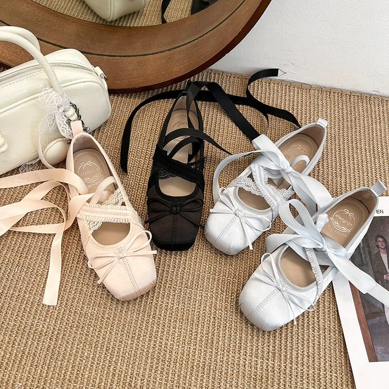 Women’s ribbon lace-up ballet flats in light pink, black, and white, square toe bows