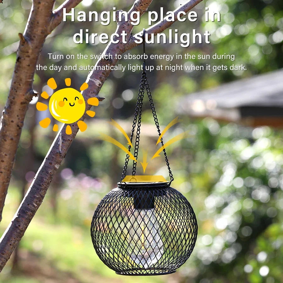 Hanging solar LED lantern in black mesh with warm glow, suspended by metal chain