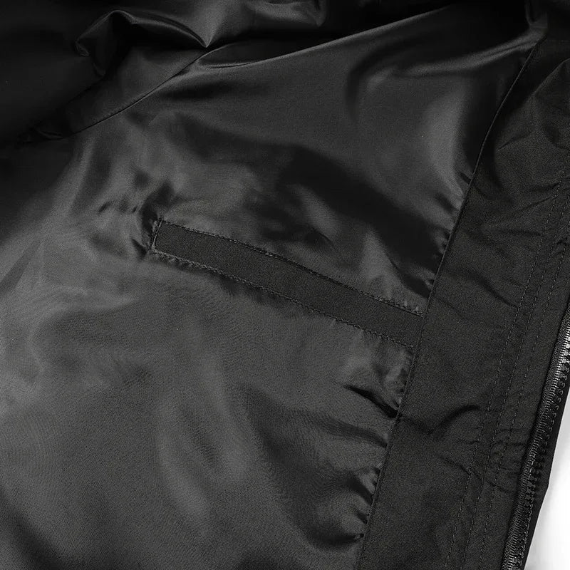 Unisex waterproof windbreaker jacket fabric detail with stitched panels and zipper.