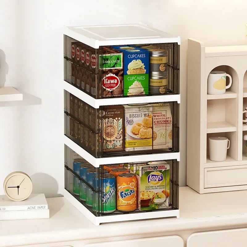 Clear stackable organizer cabinet with transparent shelves holding packaged items