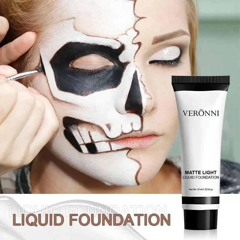 Matte liquid foundation tube beside white skull face makeup with black details