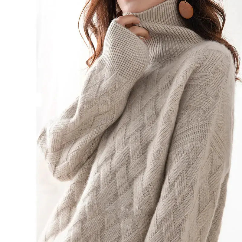 Light cream oversized sweater with ribbed turtleneck and raised cable diamond knit