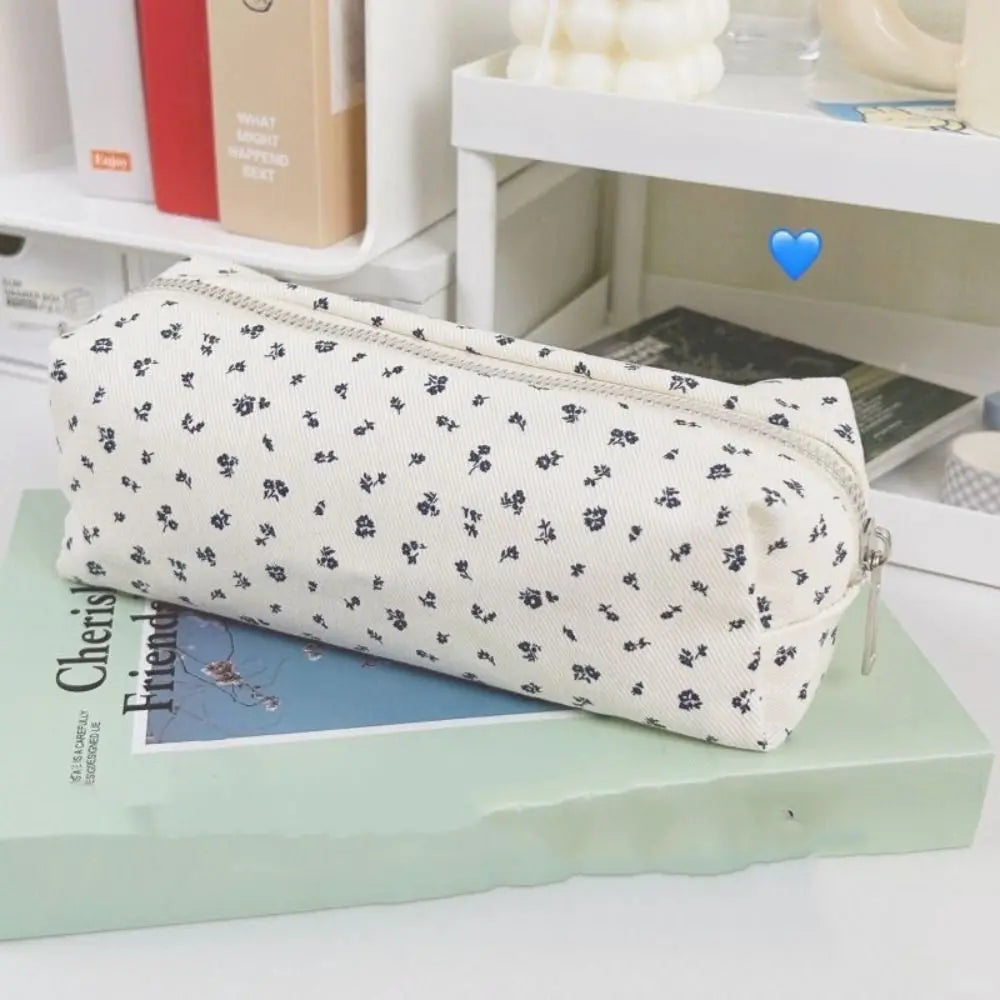Floral canvas pencil case with navy allover flower print and metal zipper