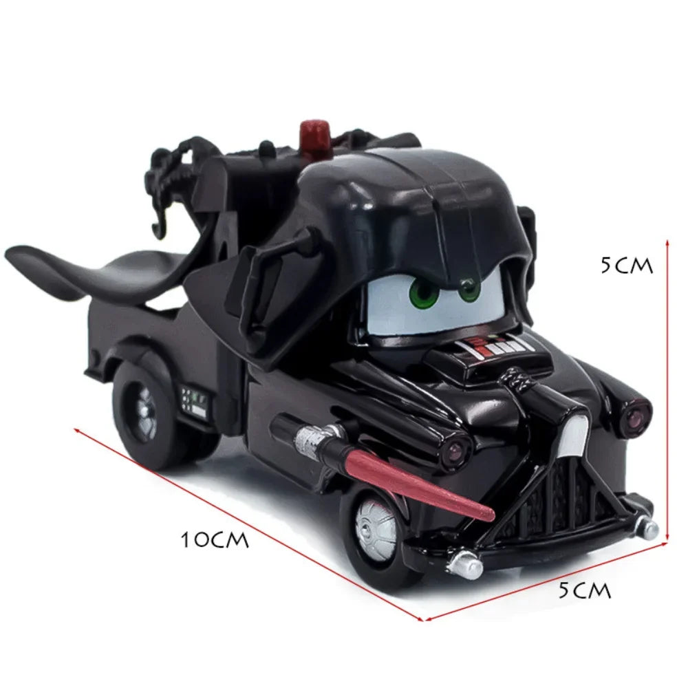 Black diecast monster truck-style vehicle with character face, front-left view.