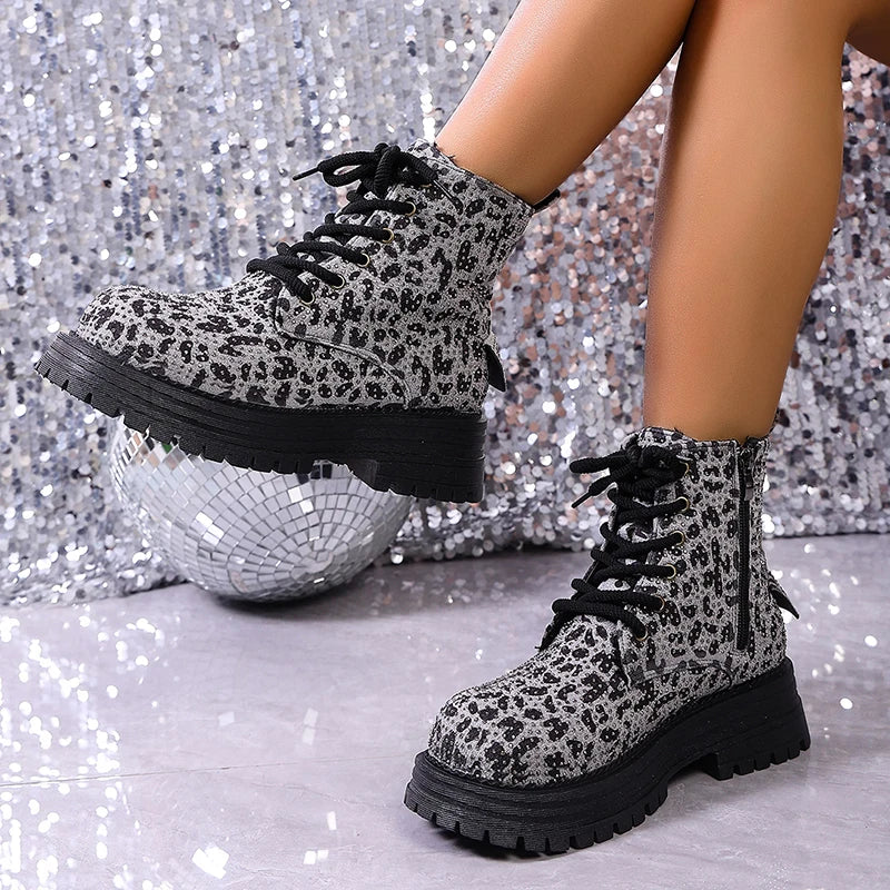 Leopard print lace-up platform ankle boots with thick black treaded sole and black laces