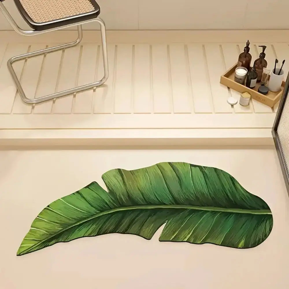 Green leaf-shaped bath mat rug with veined design, long leaf outline