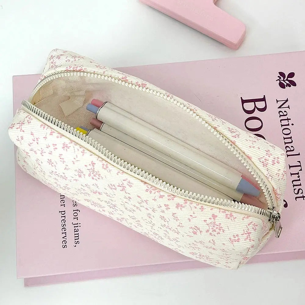 Canvas pencil pouch with zipper opening, cream base with red mini floral print