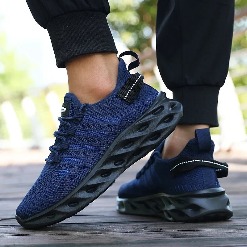 Blue knit lace-up sports shoes with thick cushioned tread sole, elastic cuff tabs