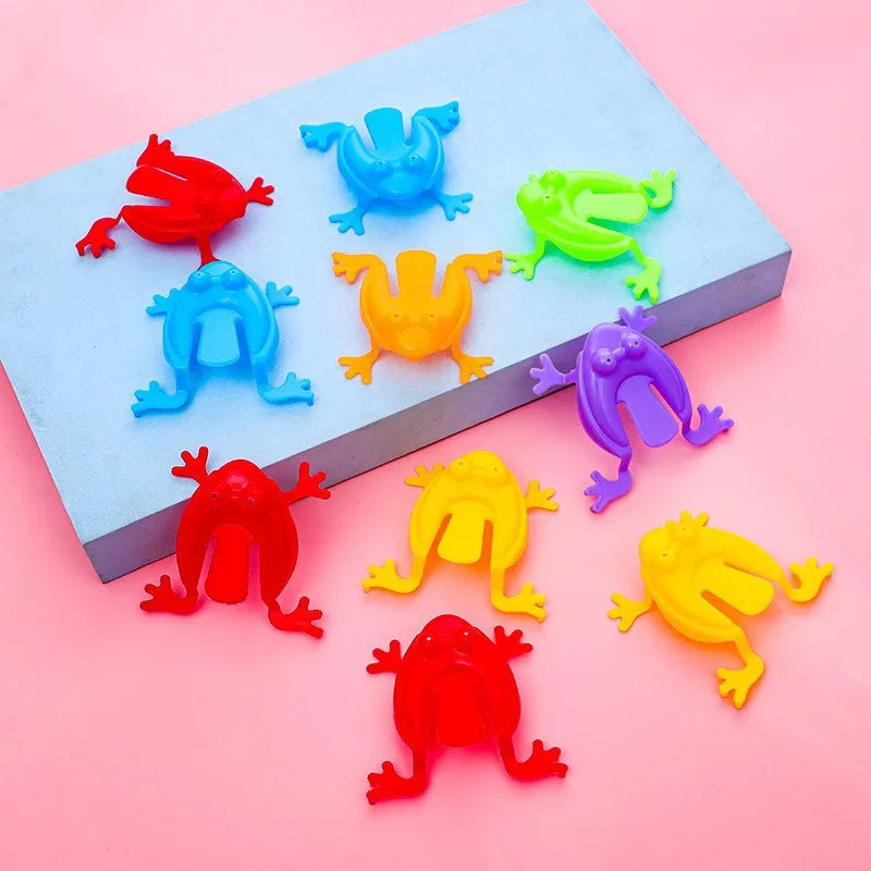 Colorful bouncing frog toy set with frogs in a box, red blue green yellow purple