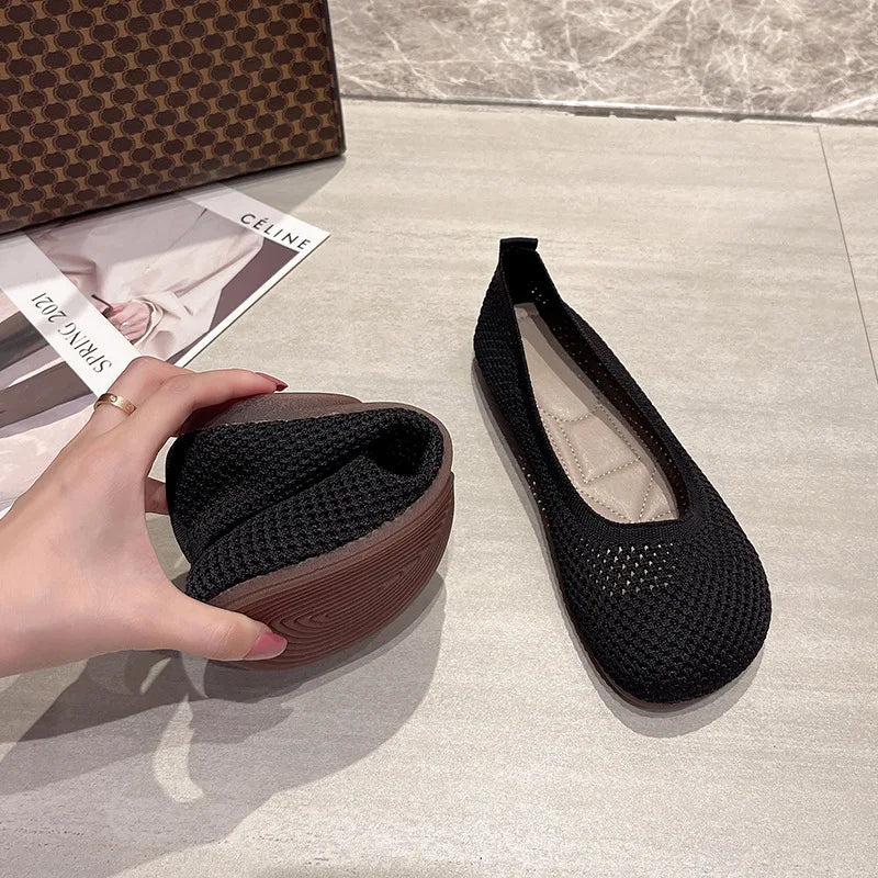 Black knitted slip-on loafers with cushioned insole and textured low sole