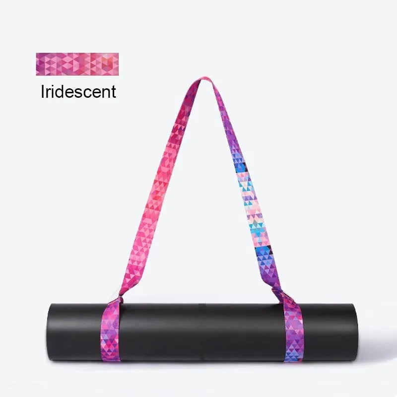 Iridescent pink-and-blue yoga mat strap with two loop handles on rolled mat