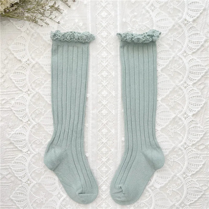 Light blue ribbed knee-high socks with ruffled cuff