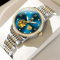 Two-tone automatic bracelet watch with blue floral dial, roman numerals, jeweled bezel