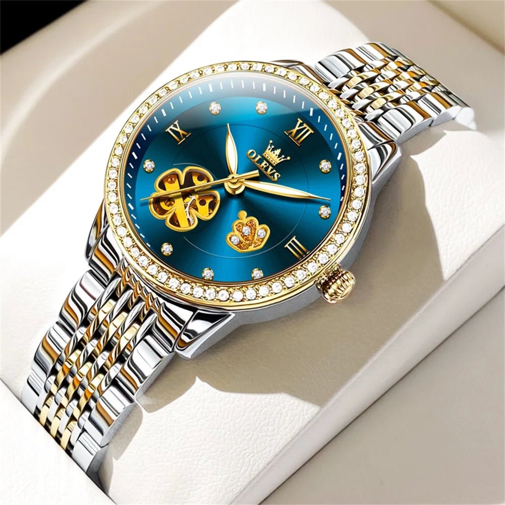 Two-tone automatic bracelet watch with blue floral dial, roman numerals, jeweled bezel