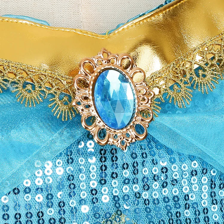 Close-up of turquoise sequin bodice with blue gem centerpiece and gold embroidered detailing