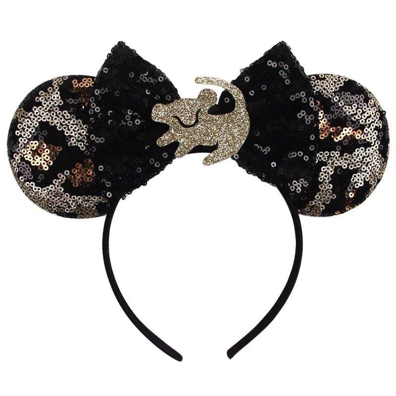 Black sequin Mickey ears headband with gold center bow detail