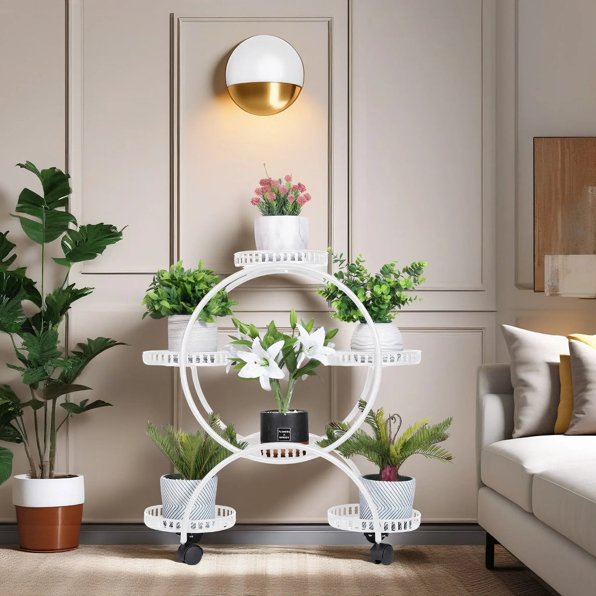 White metal rolling plant stand with four trays and caster wheels for plants