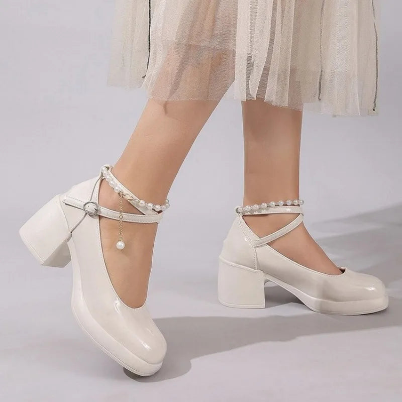 Off-white Mary Jane pumps with square toe, ankle strap, pearl trim, block heel