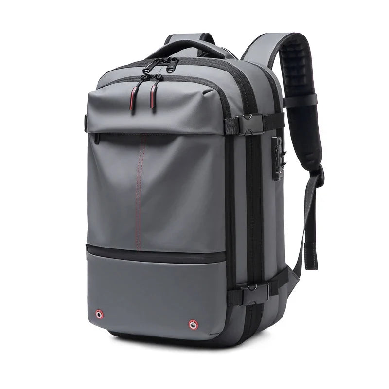 Grey 17-inch laptop backpack with front zip pocket, top handle, and padded straps