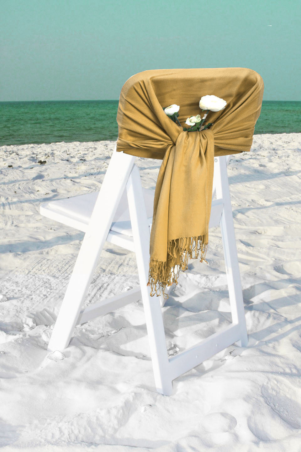 Olive-gold pashmina-style shawl wrap scarf draped over a chair with fringe