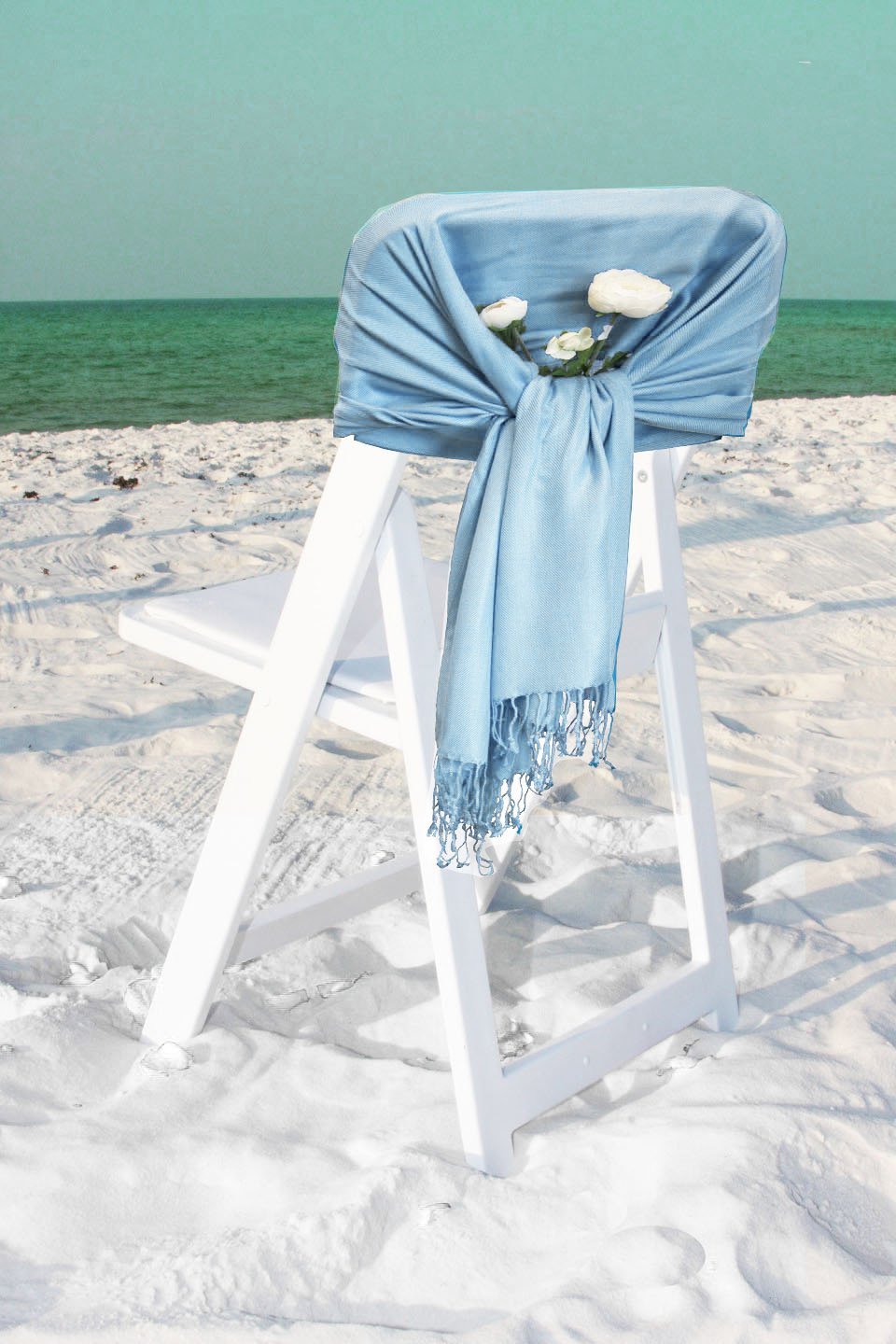 Pashmina-feel shawl wrap scarf in light blue, draped over chair, fringed ends