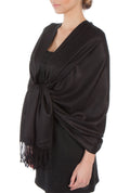 Pashmina-feel shawl wrap scarf in dark black, draped over shoulder, fringed hem
