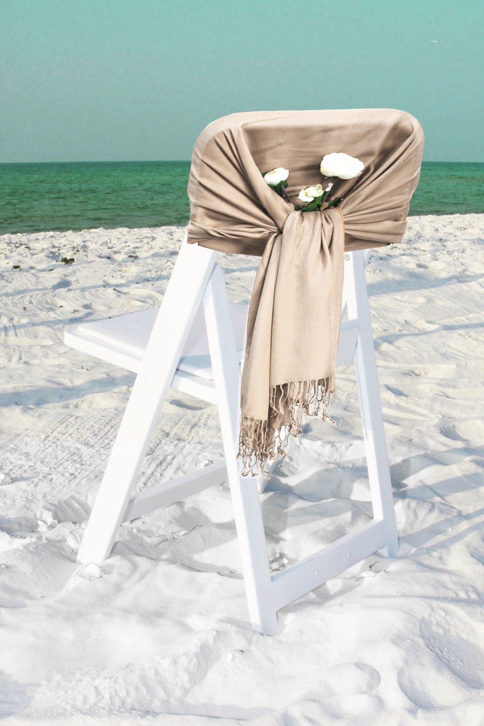 Light beige silky pashmina-style shawl with fringed ends, wrapped and draped.