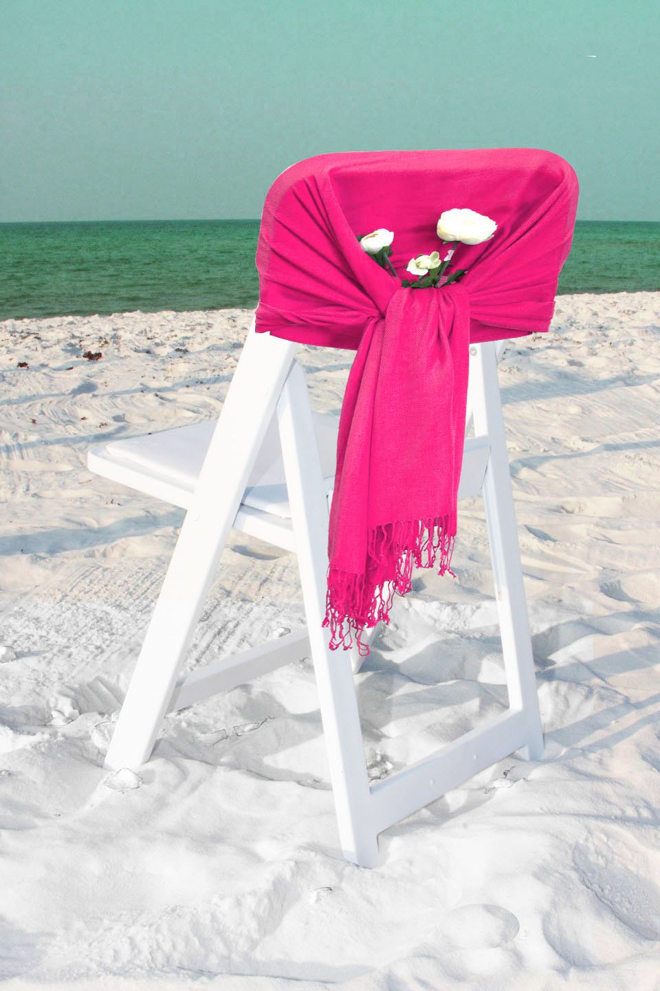 Hot pink pashmina-style shawl with fringed ends, wrapped and draped scarf