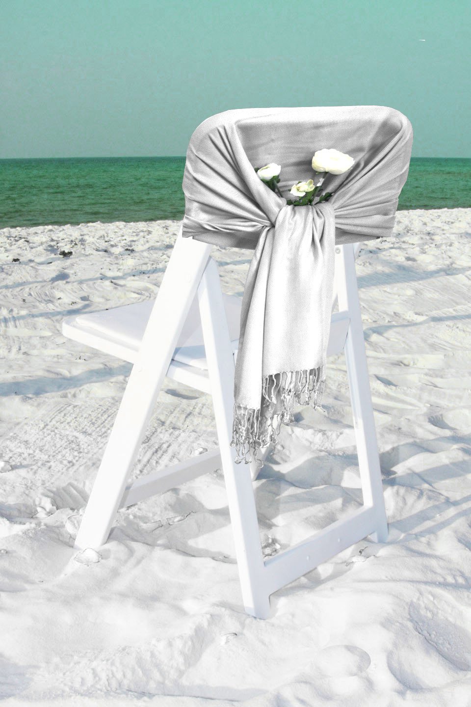 White pashmina-feel shawl scarf, draped and fringed over chair back