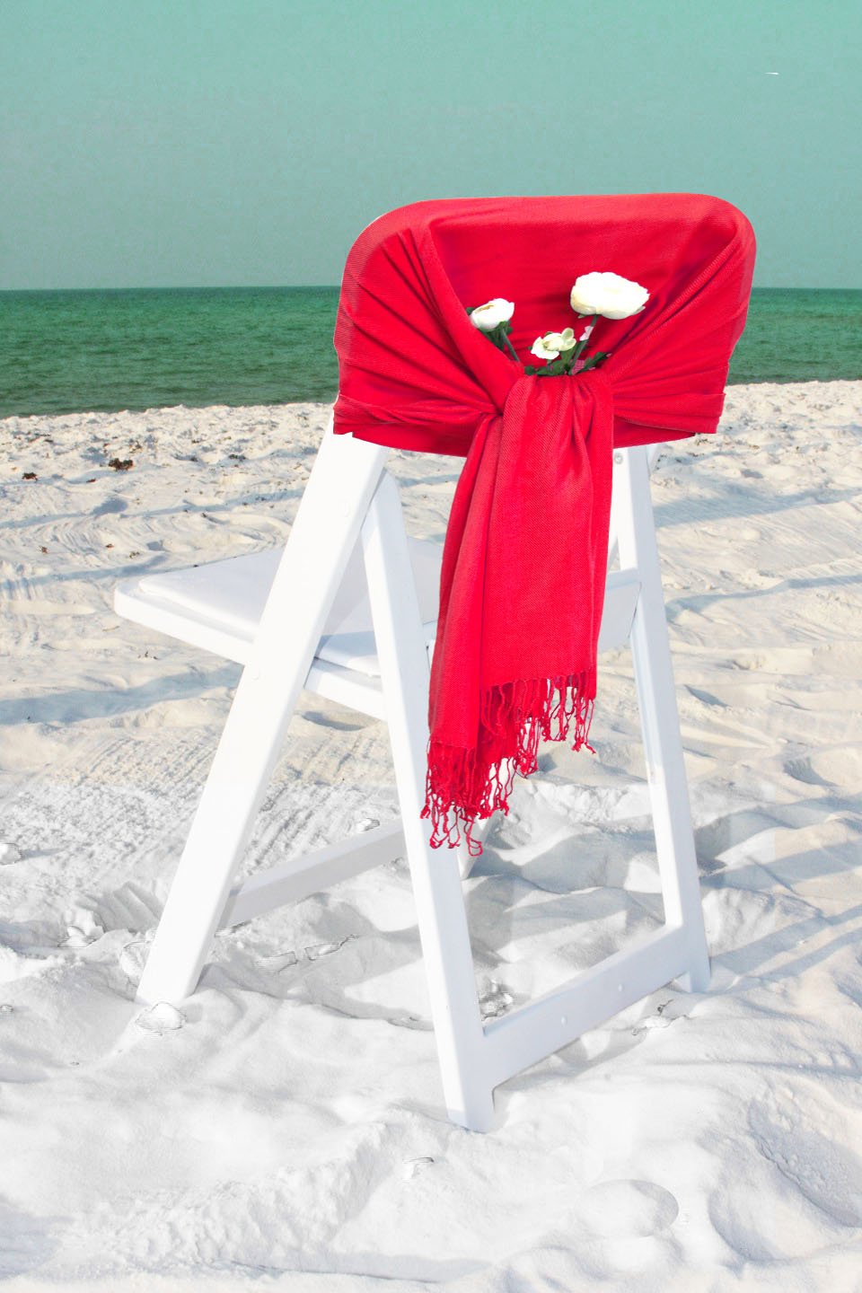Solid red pashmina-feel shawl wrap scarf with long fringed ends.