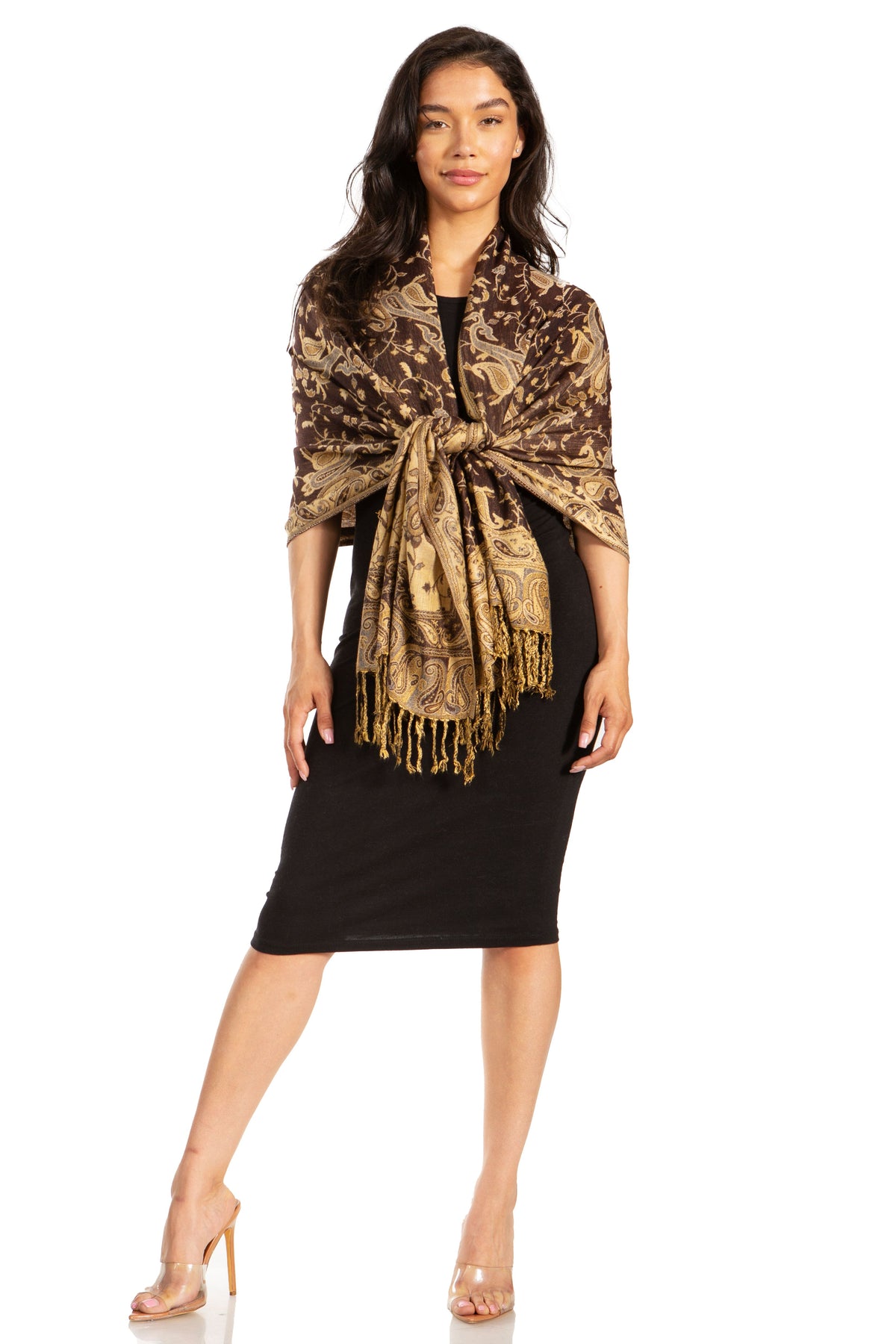 Brown and gold paisley pashmina shawl with fringe trim, worn over black dress