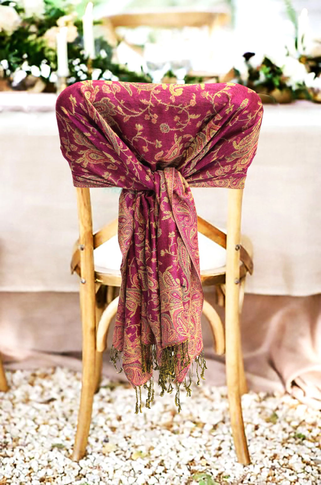 Burgundy paisley pashmina shawl with fringed ends tied at the center
