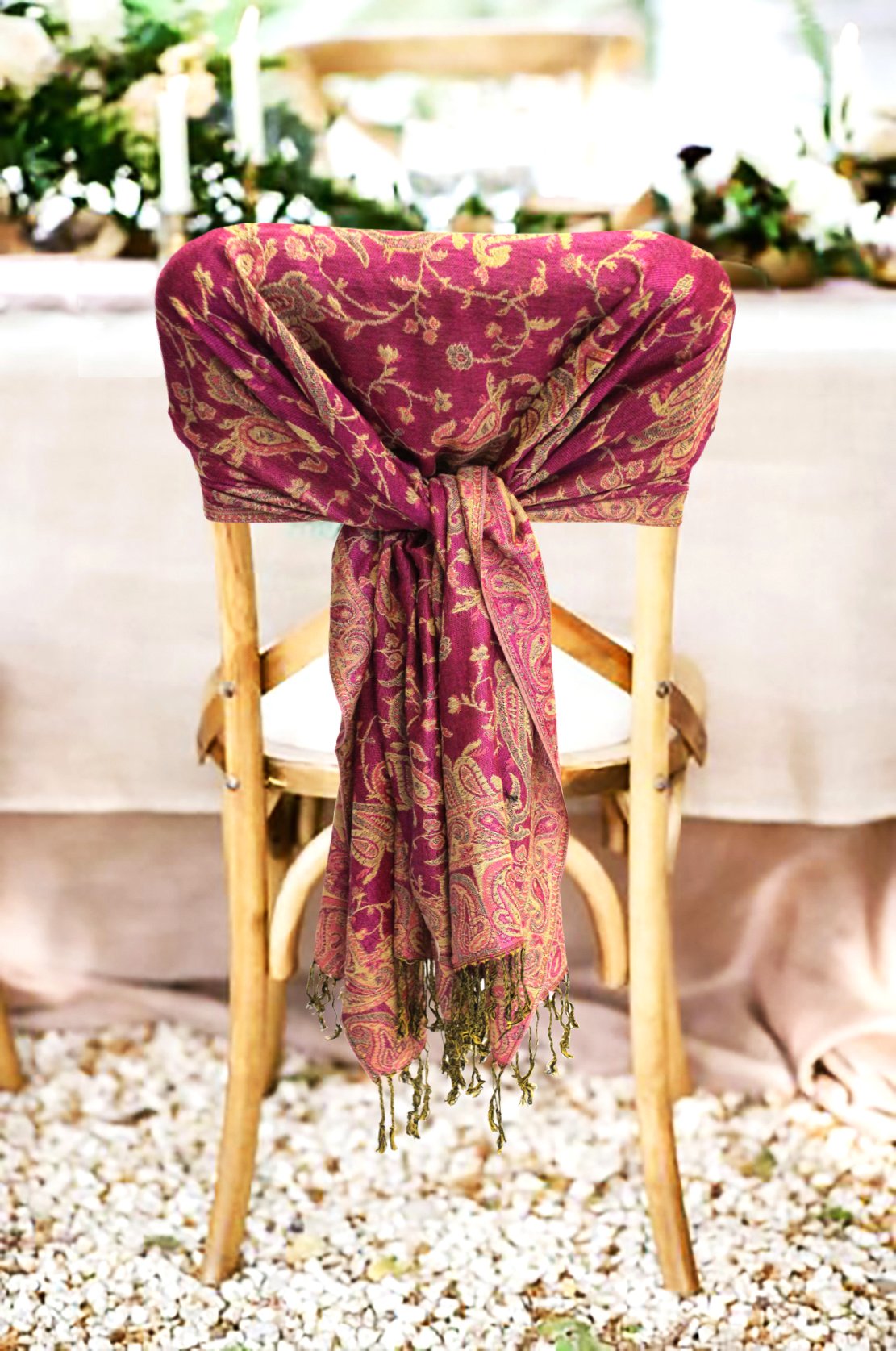 Burgundy paisley pashmina shawl with fringed ends tied at the center