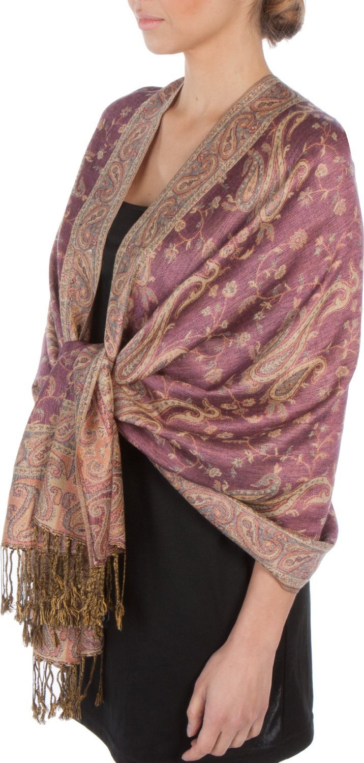 Purple paisley pashmina shawl wrap with gold fringe tassels, draped over dark top.