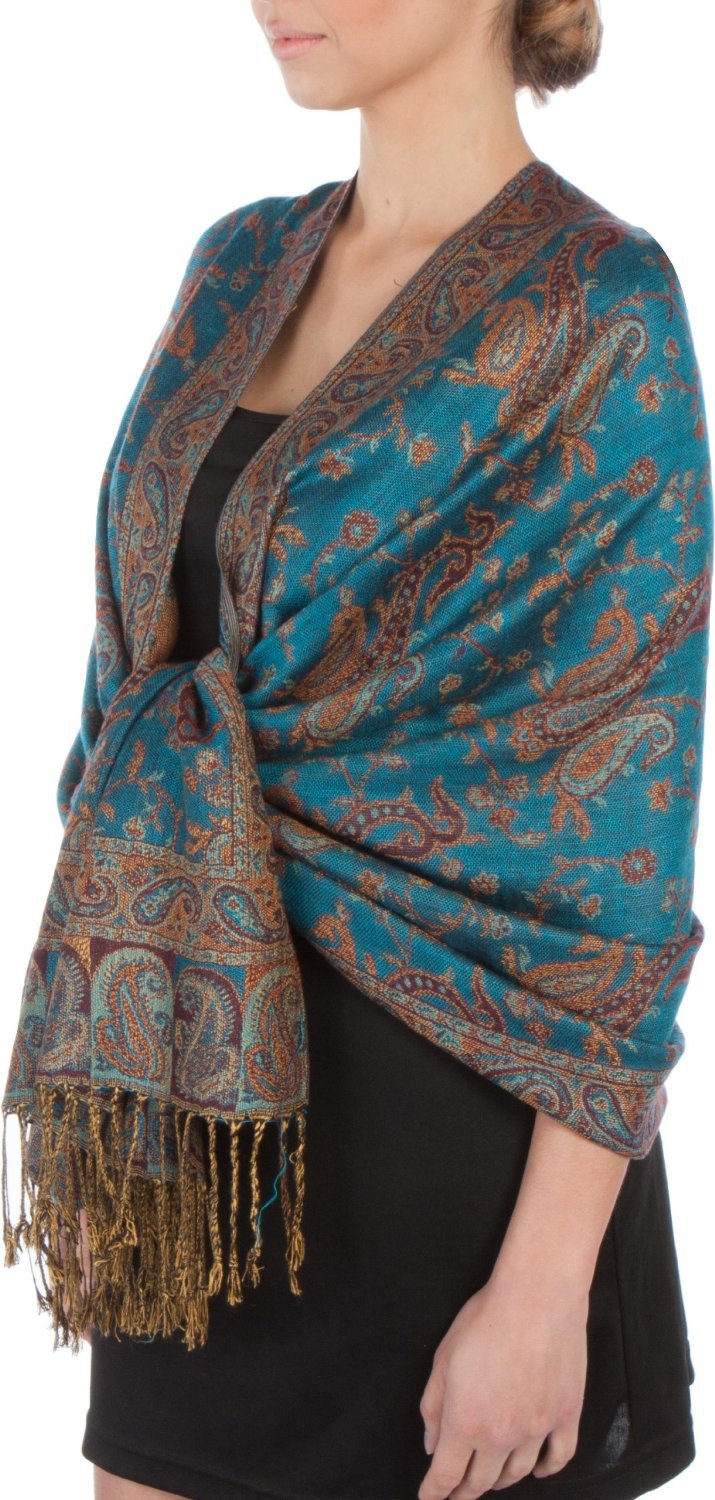 Teal paisley pashmina shawl with gold-tone accents and fringe, worn on shoulders