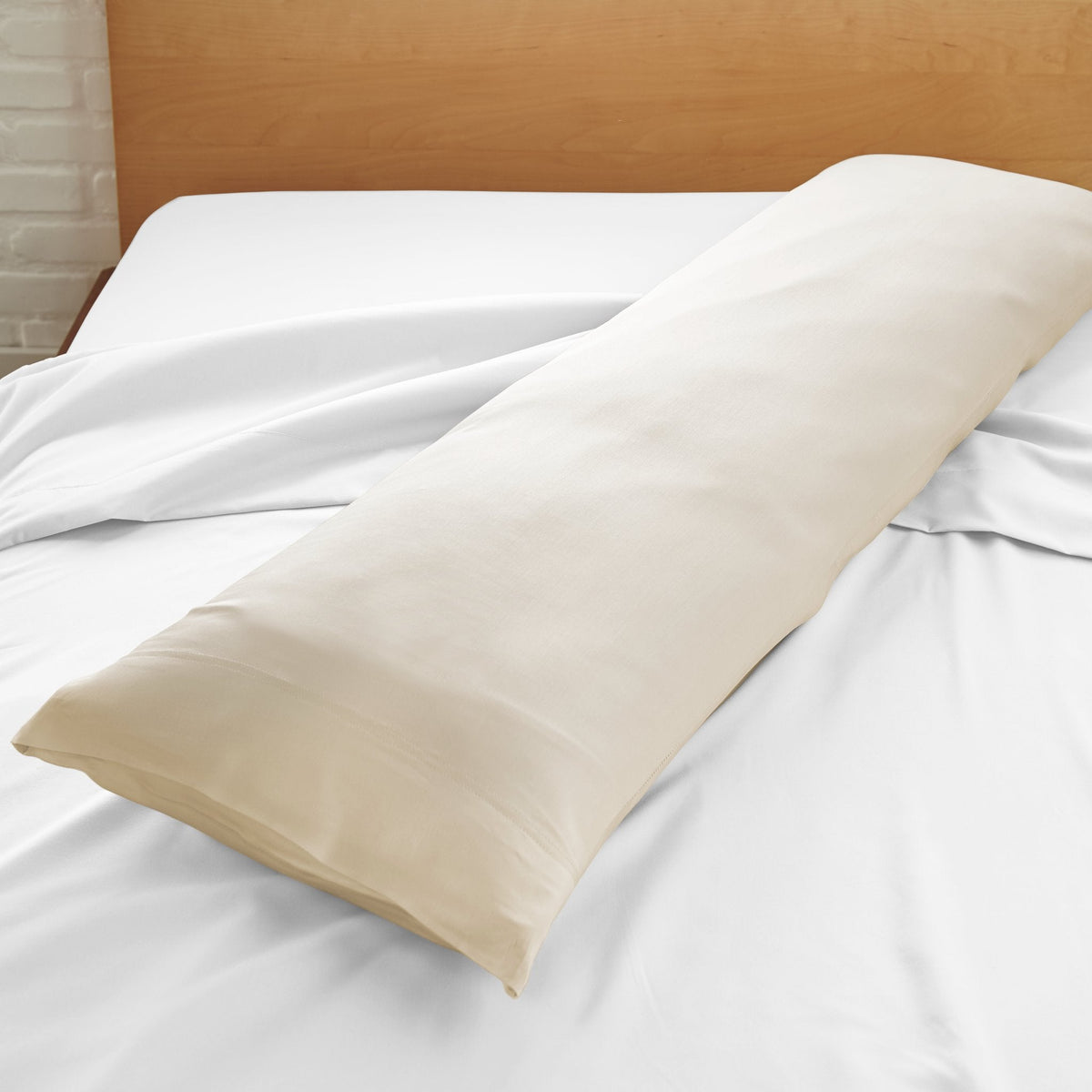 Cooling bamboo body pillowcase in ivory beige, angled view with end flap visible.