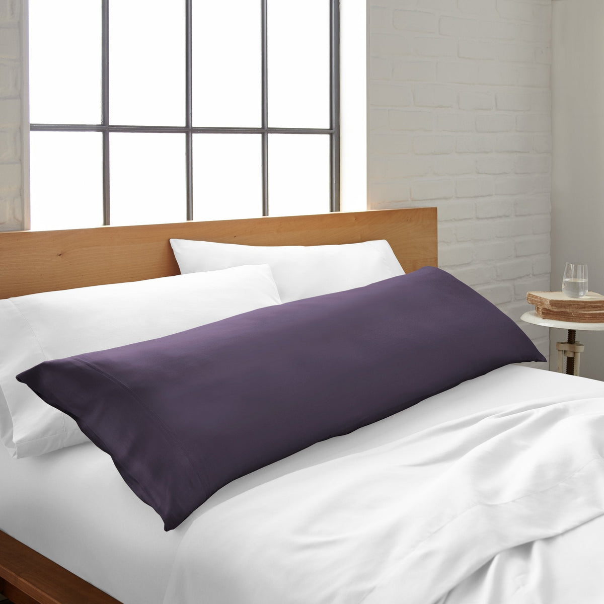 Royal purple body pillowcase with smooth fabric on bed