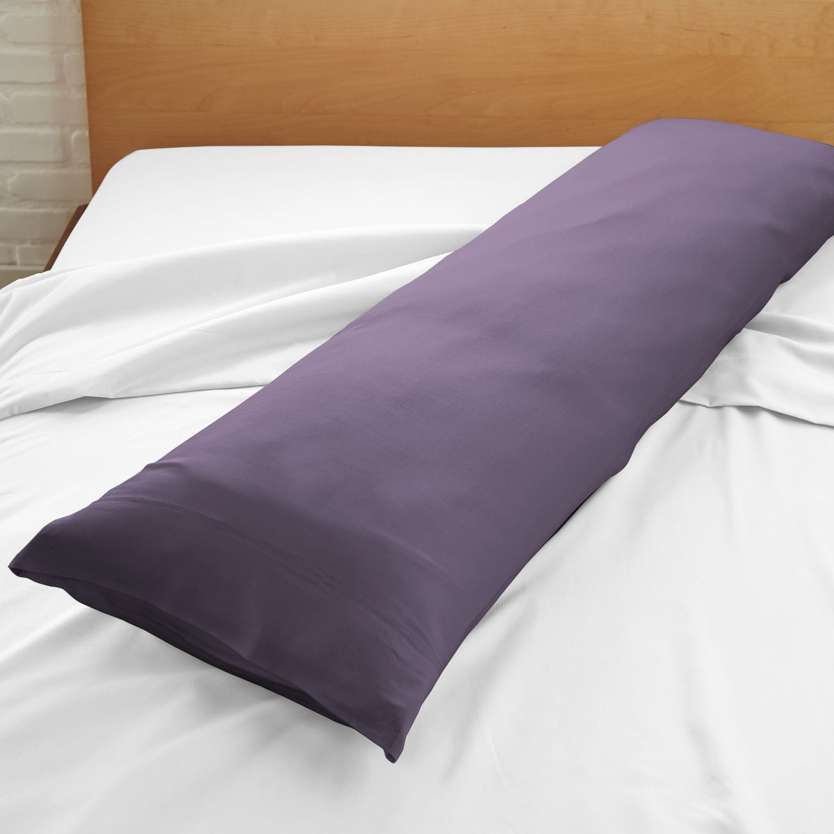 Lavender-purple body pillowcase close-up on bed