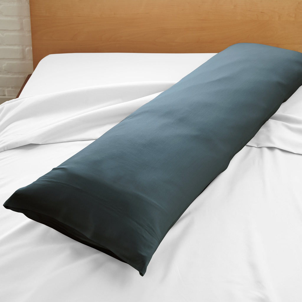 Blue-gray body pillowcase with smooth fabric, laid flat on bed