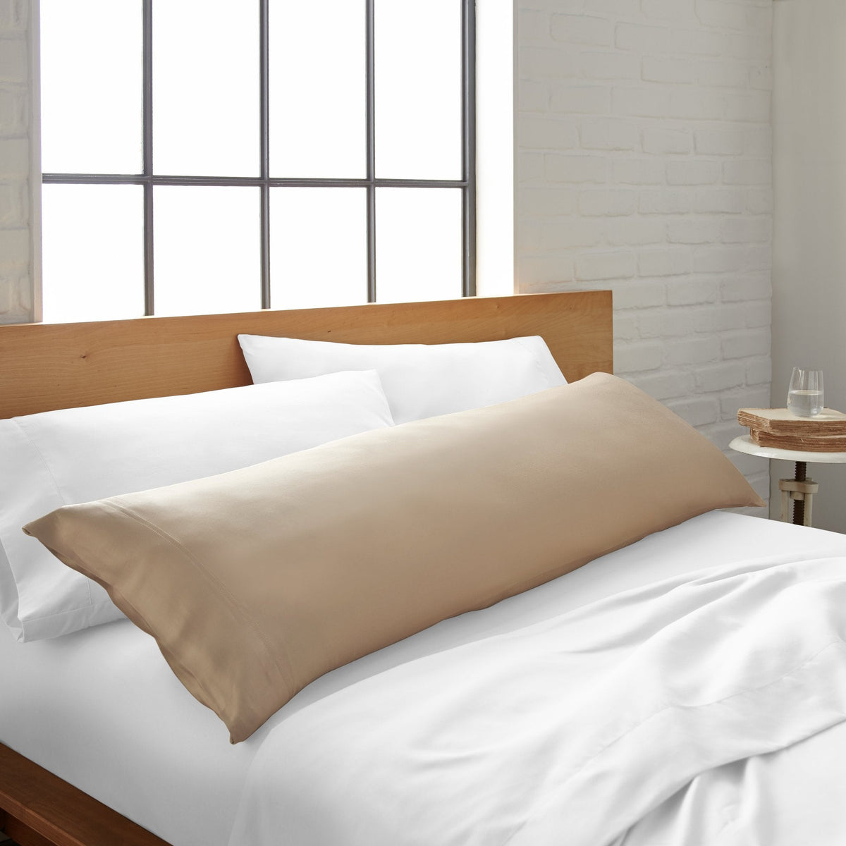 Cooling bamboo body pillowcase in taupe beige, long rectangular pillowcase on bed.