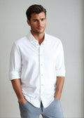 White button-front long-sleeve shirt with collar and vertical button placket
