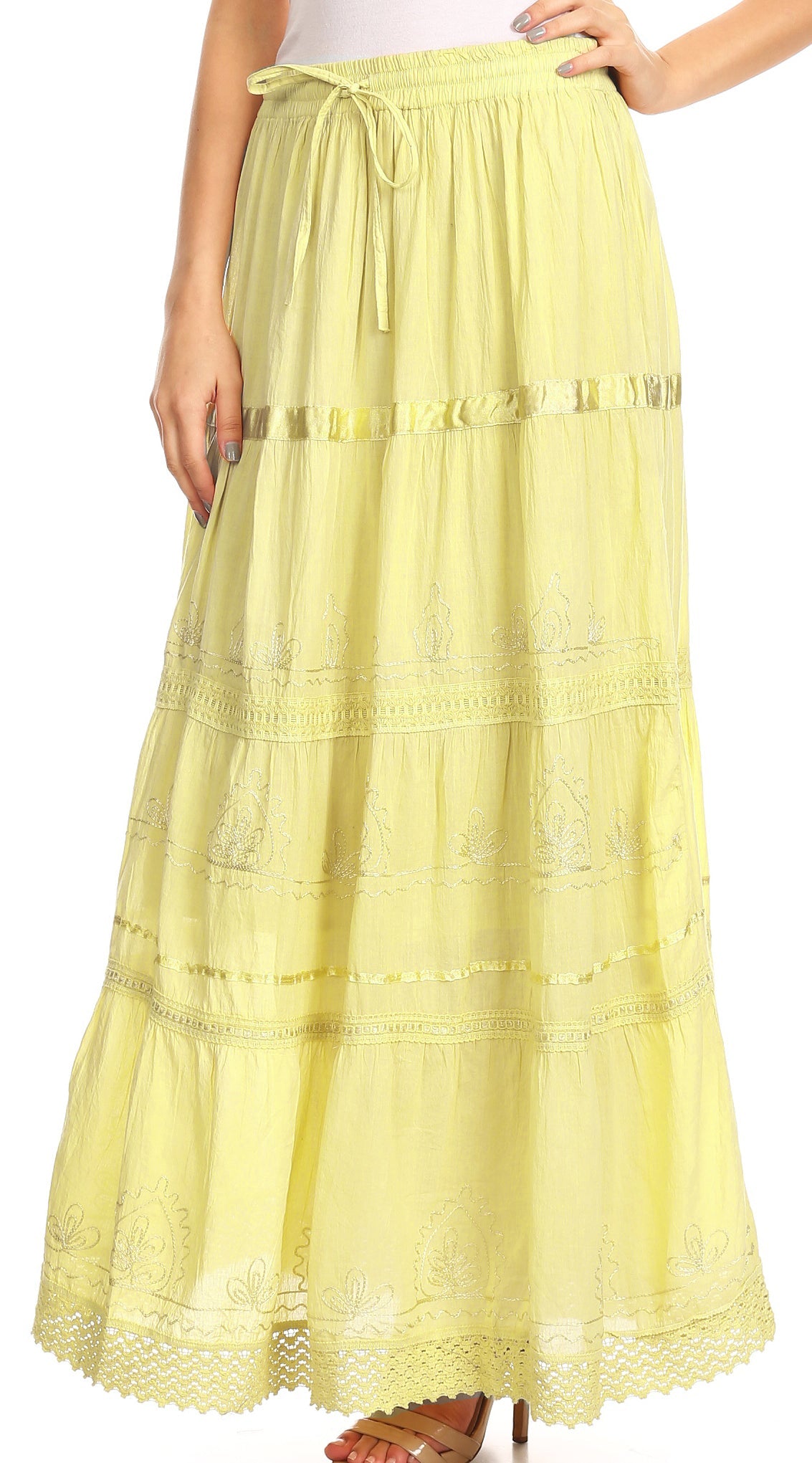 Sunny yellow maxi cotton skirt with gathered tiers, embroidered bands, and lace edge