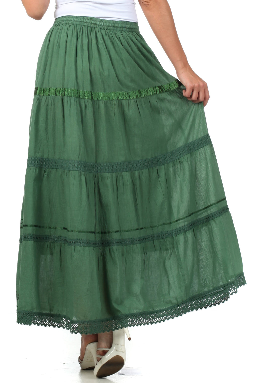 Green tiered gypsy skirt with smocked waistband, decorative embroidery, and lace edge